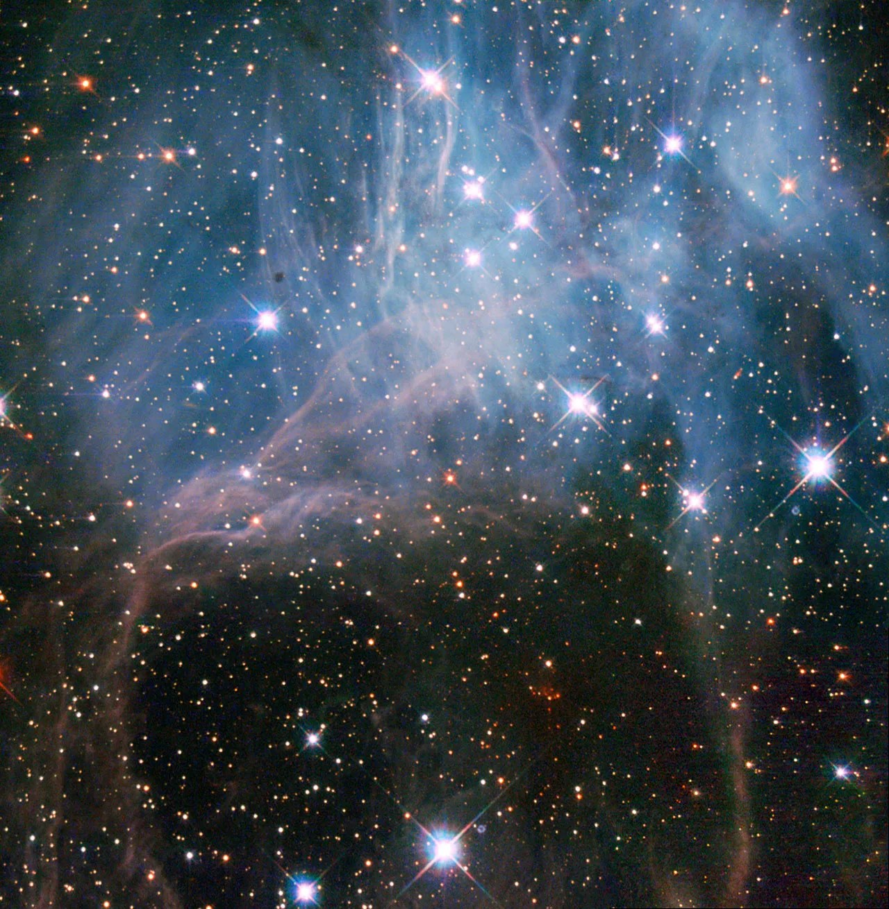 stars peer through a blue/lavender haze in NGC 2040
