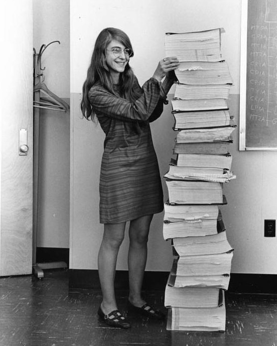 Computer scientist Margaret Hamilton poses with the Apollo guidance software she and her team developed at MIT