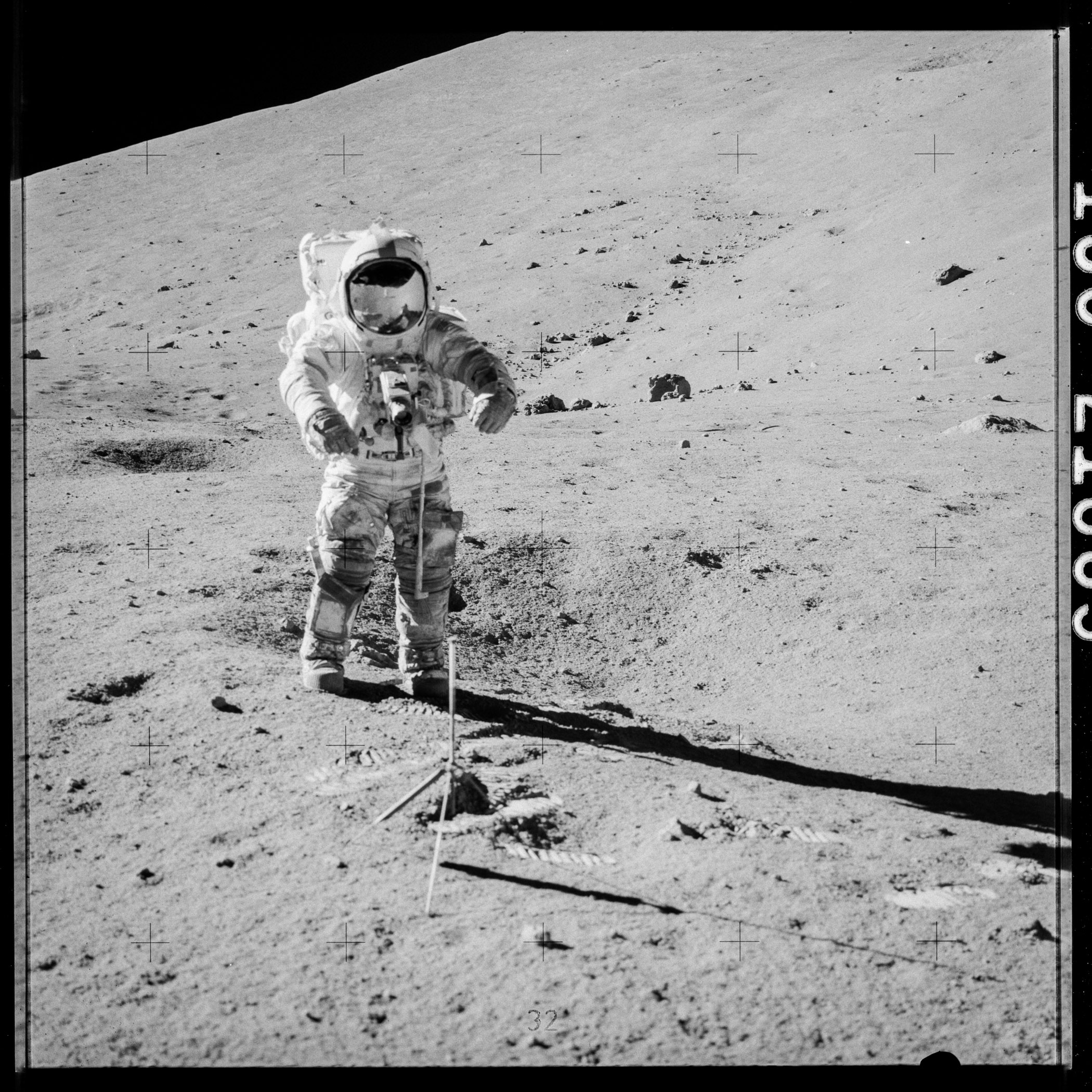 Photo of astronaut on the Moon digging into the surface.