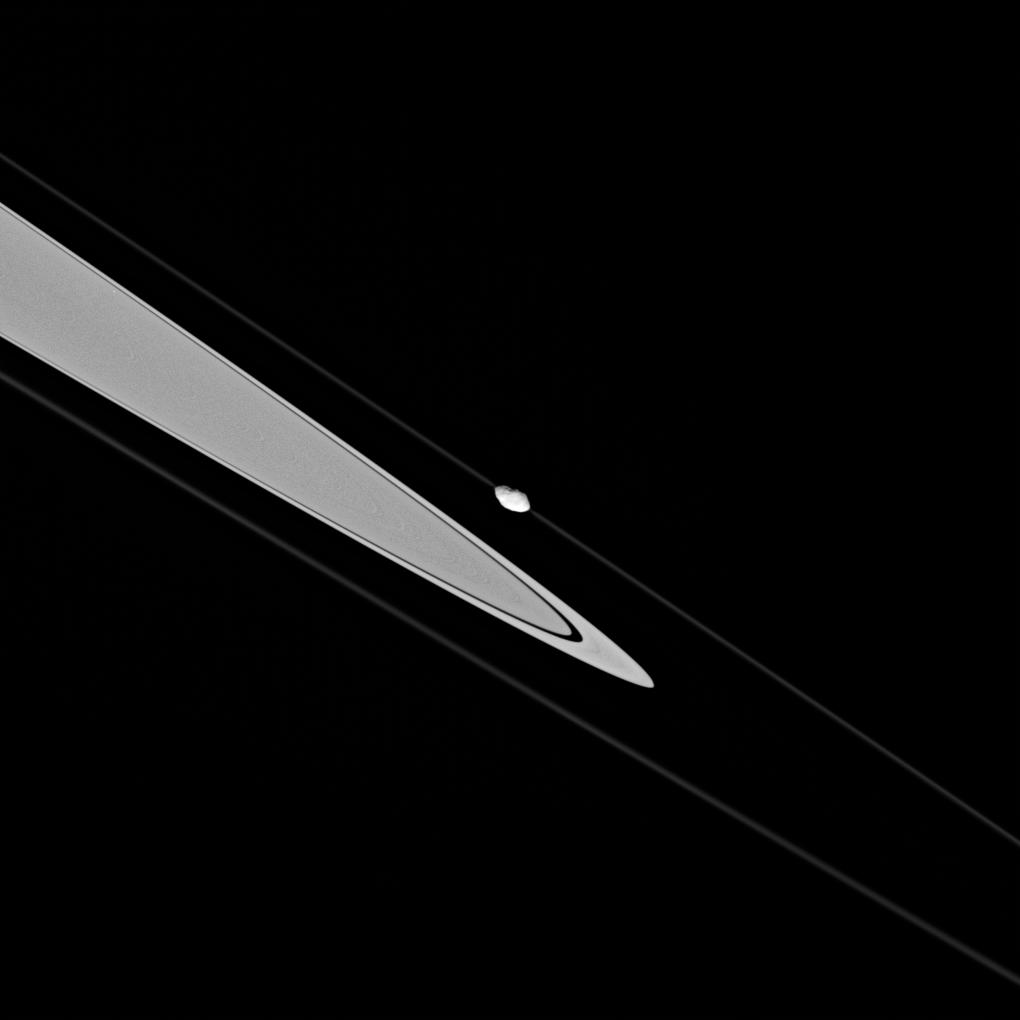 Pandora near a portion of Saturn's rings