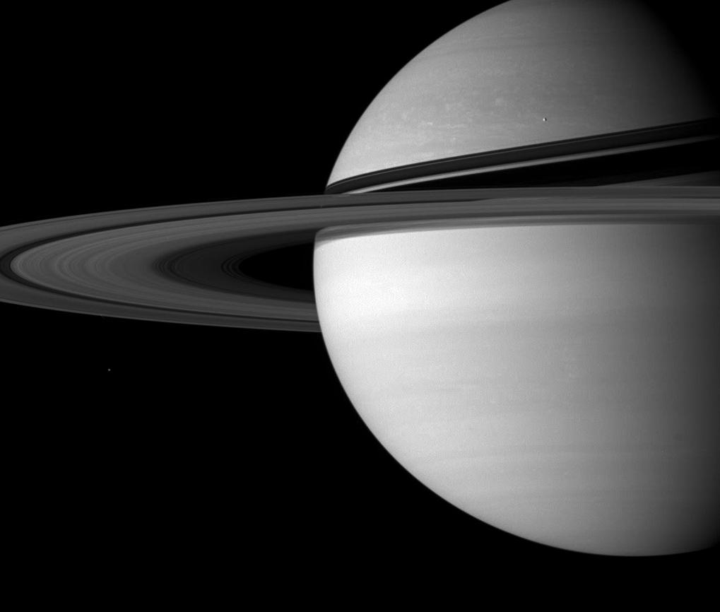 Saturn, rings, and two small moons